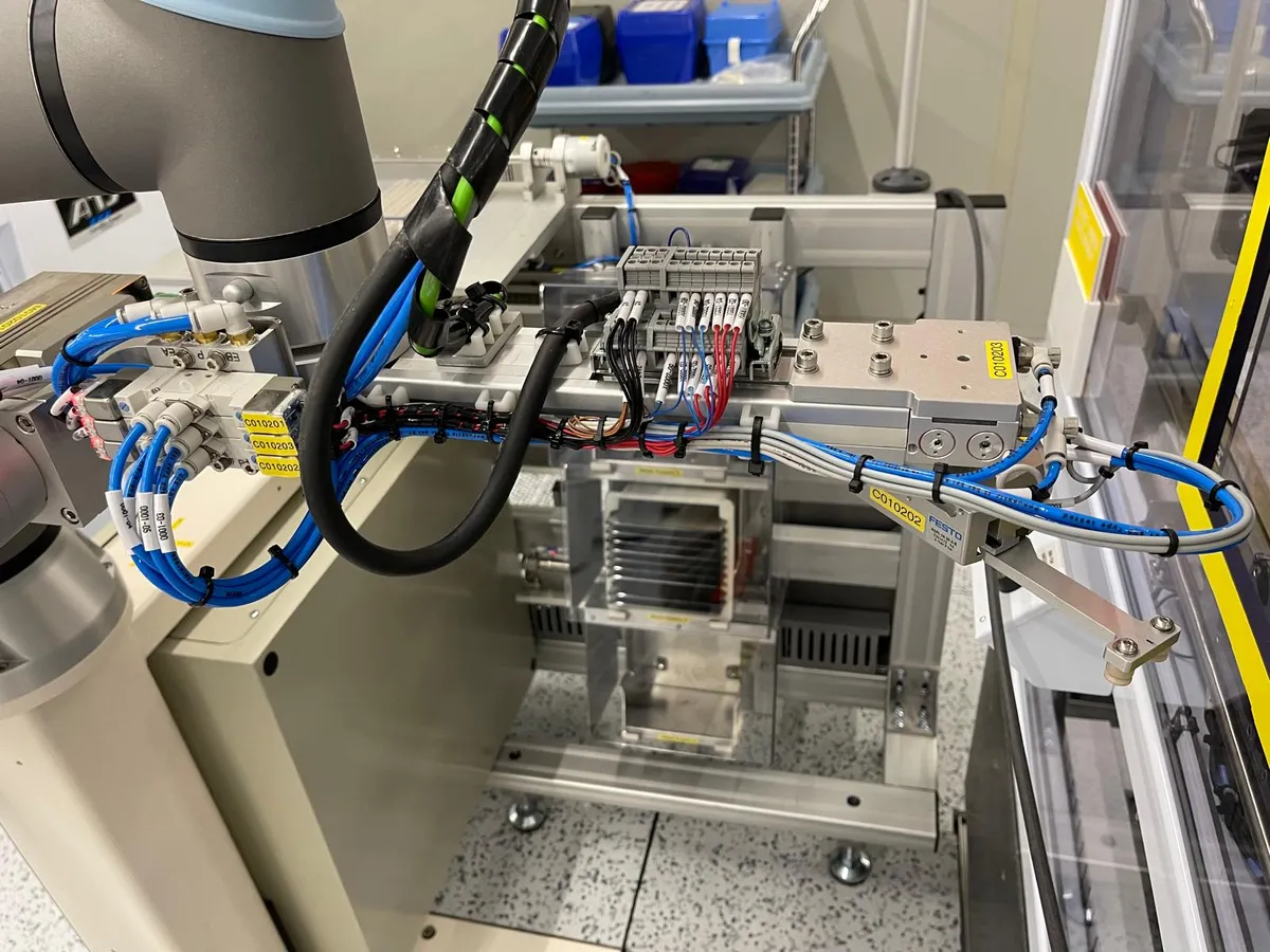 Close-up of end-of-arm tooling for delicate wafer alignment